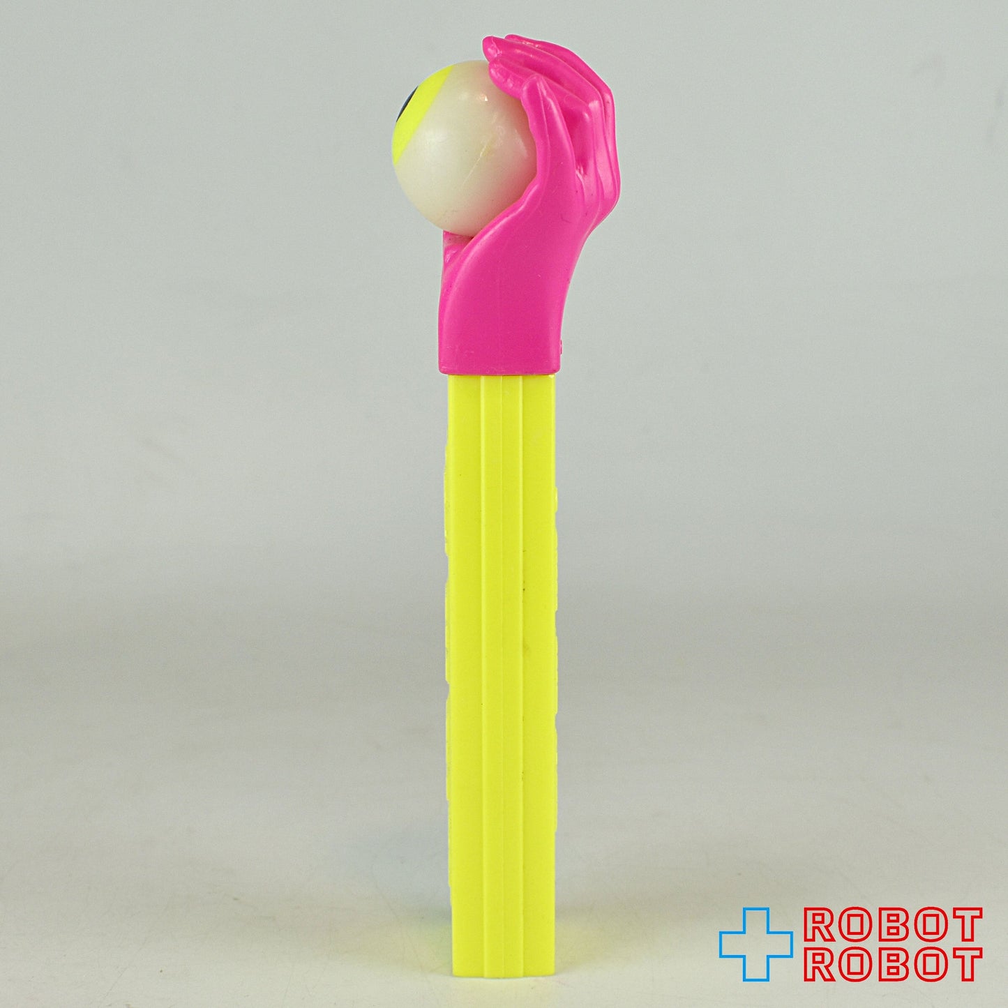 PEZ サイケデリックアイ ネオンカラー ピンクハンド/黄ステム