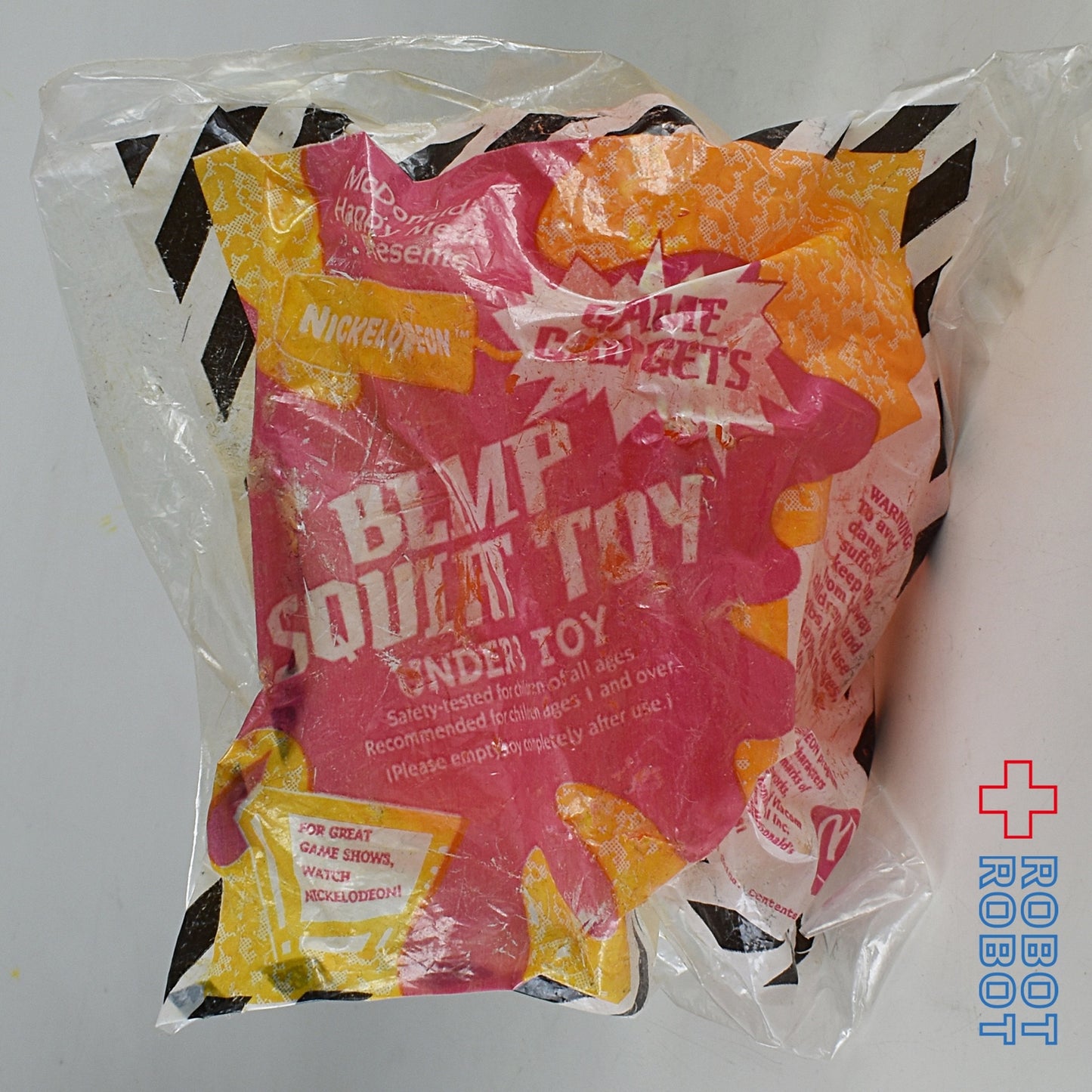 マクドナルド ニコロデオン オレンジのロゴ入り飛行船 水鉄砲 U3ハッピーミールトイ 袋入