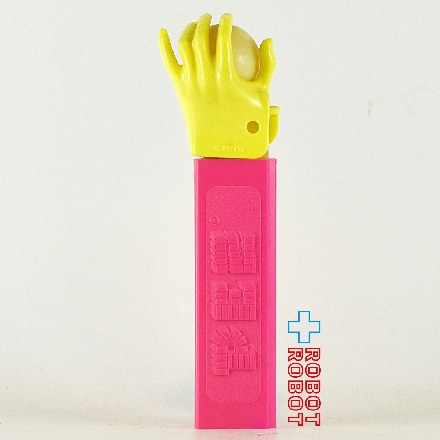 PEZ サイケデリックアイ ネオンカラー 黄ハンド/ピンクステム